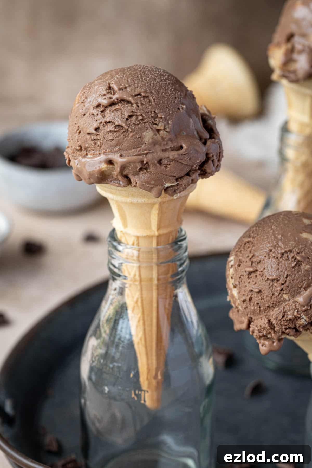 Close up of a cone of chocolate peanut butter ice cream.