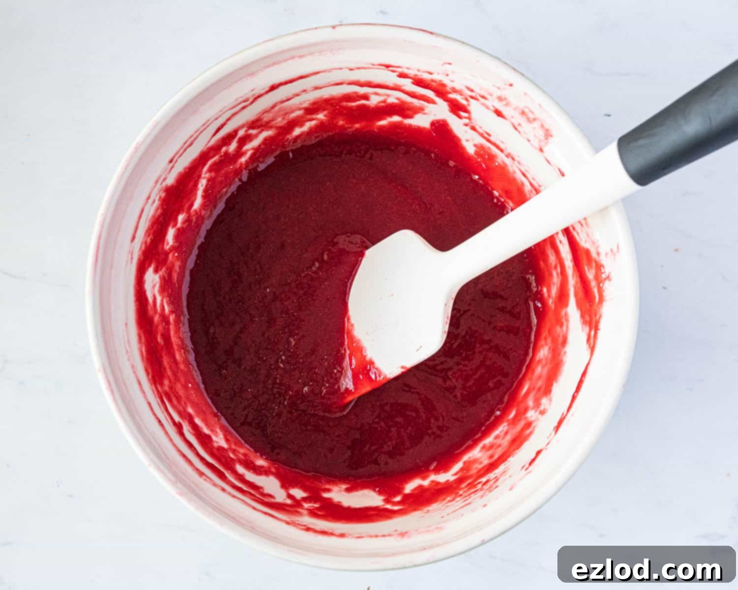 Step 2: The strained, seedless raspberry compote in a bowl.