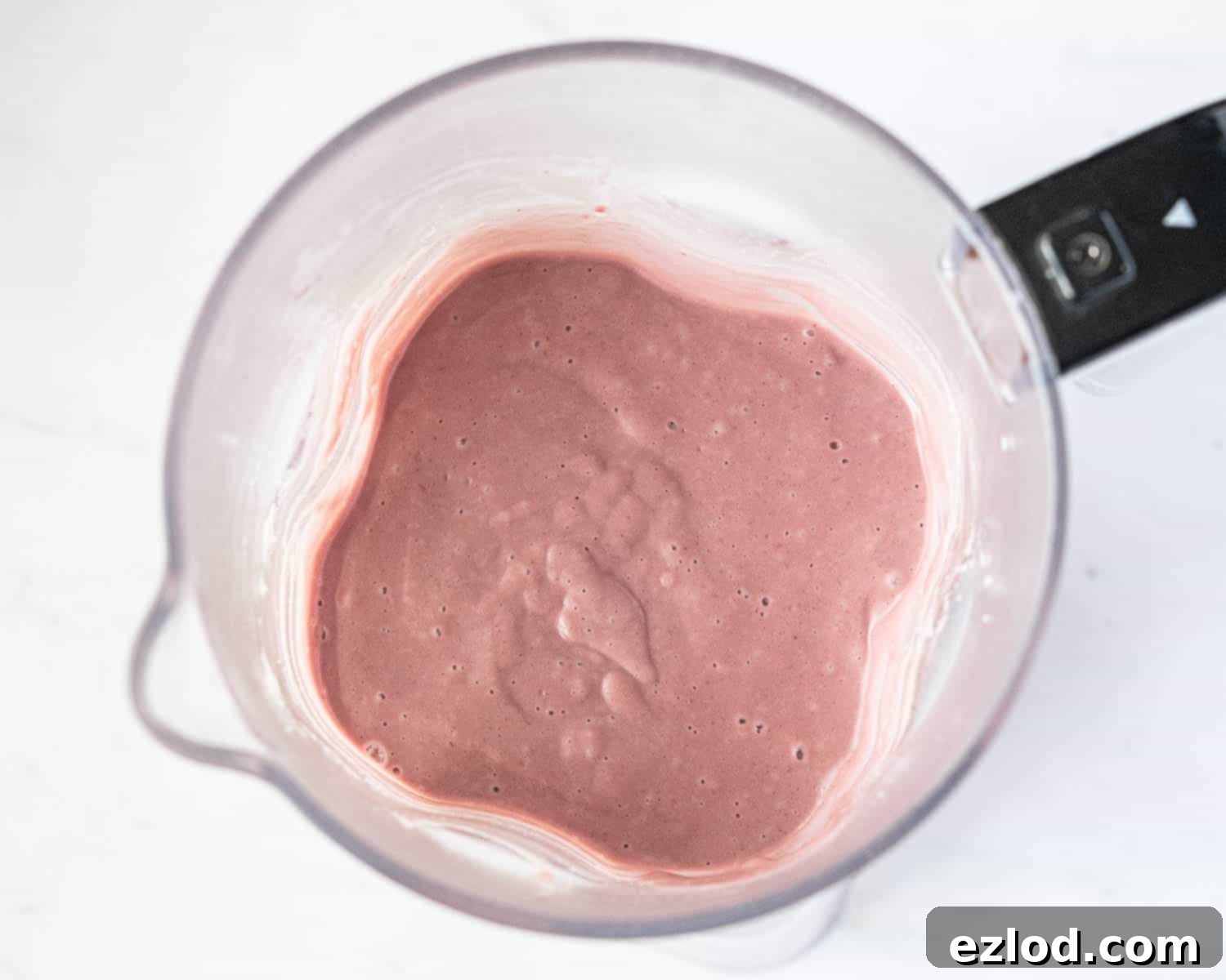 The smooth, blended ice cream base in a blender.