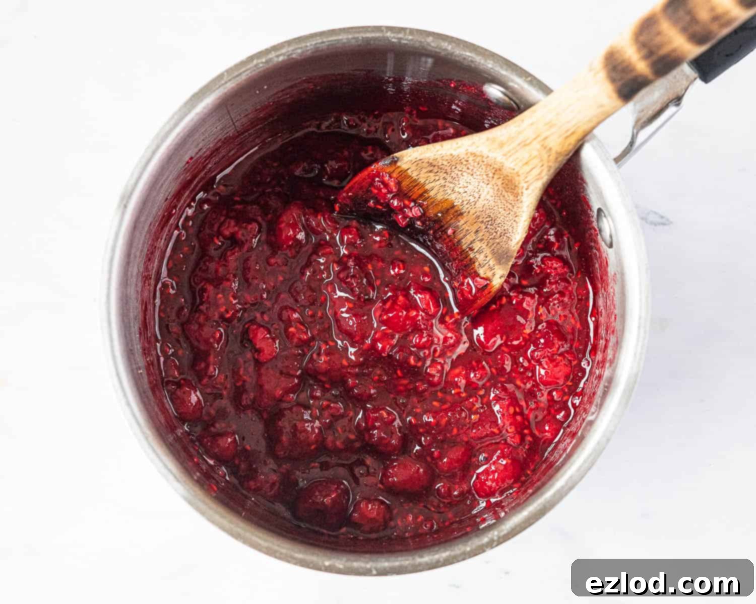 The raspberry swirl mixture simmering in a small pan.