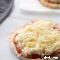 A delicious personal-sized gluten-free Greek yogurt pizza, freshly baked and ready to eat.