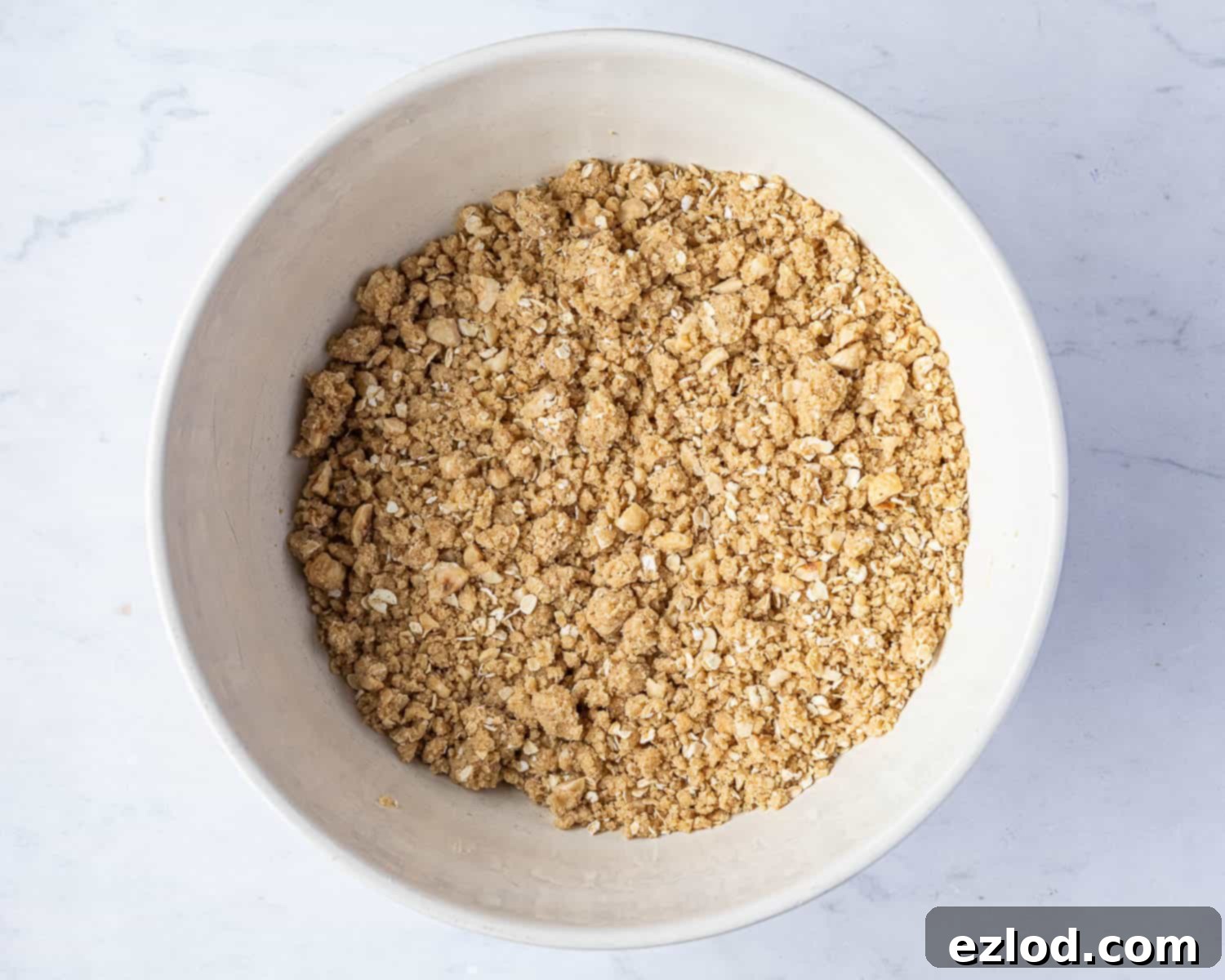 Step 3, adding the oats, sugar and hazelnuts.