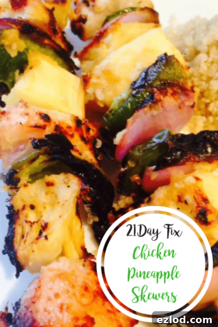 Diced chicken, pineapple, green pepper, and red onion are threaded on skewers and grilled, with the text overlay 21 Day Fix Chicken Pineapple Skewers