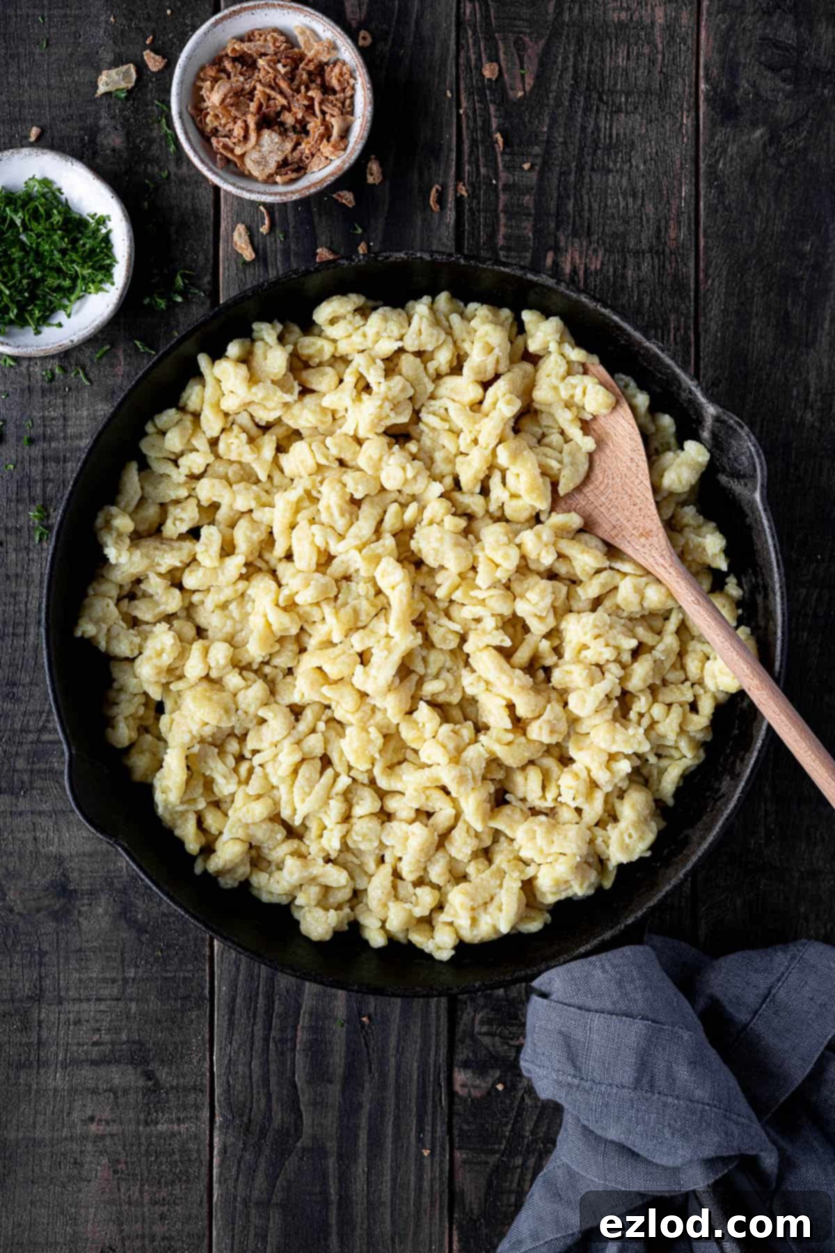 Vegan spaetzle in a cast iron skillet.