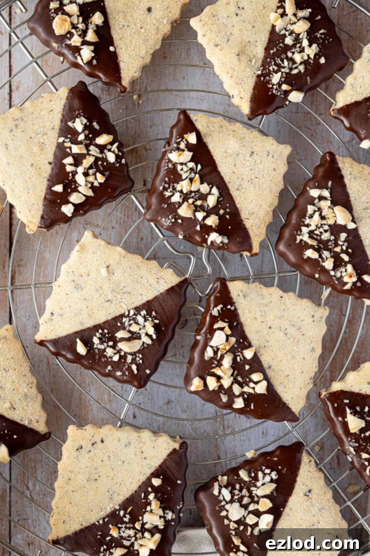 Close up of vegan hazelnut shortbread cookies on a wire cooling rack.