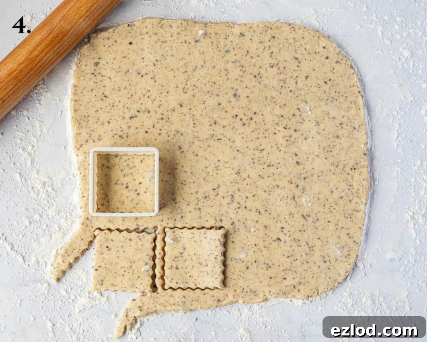 Step 4, the rolled  out doing being cut into shapes with a cookie cutter.