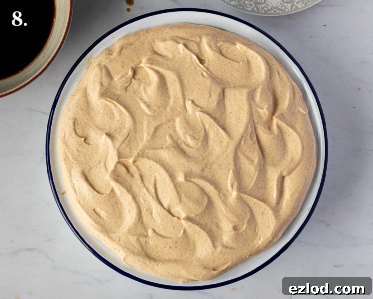 Step 8, the finished tiramisu before the cocoa powder is added.