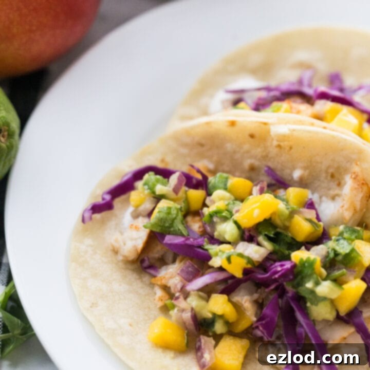 Fish tacos with mango salsa and a lime wedge