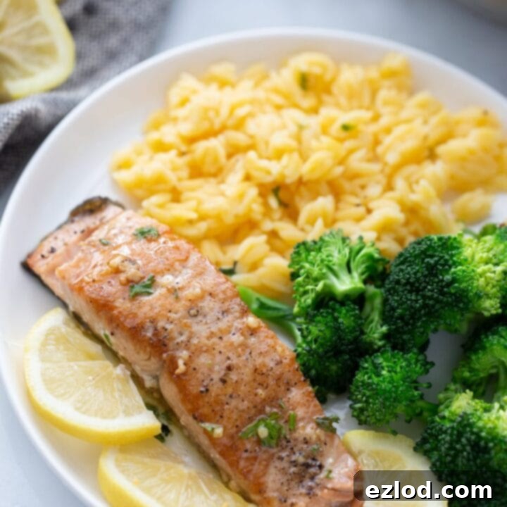 Crispy pan-seared salmon fillet with lemon and herbs