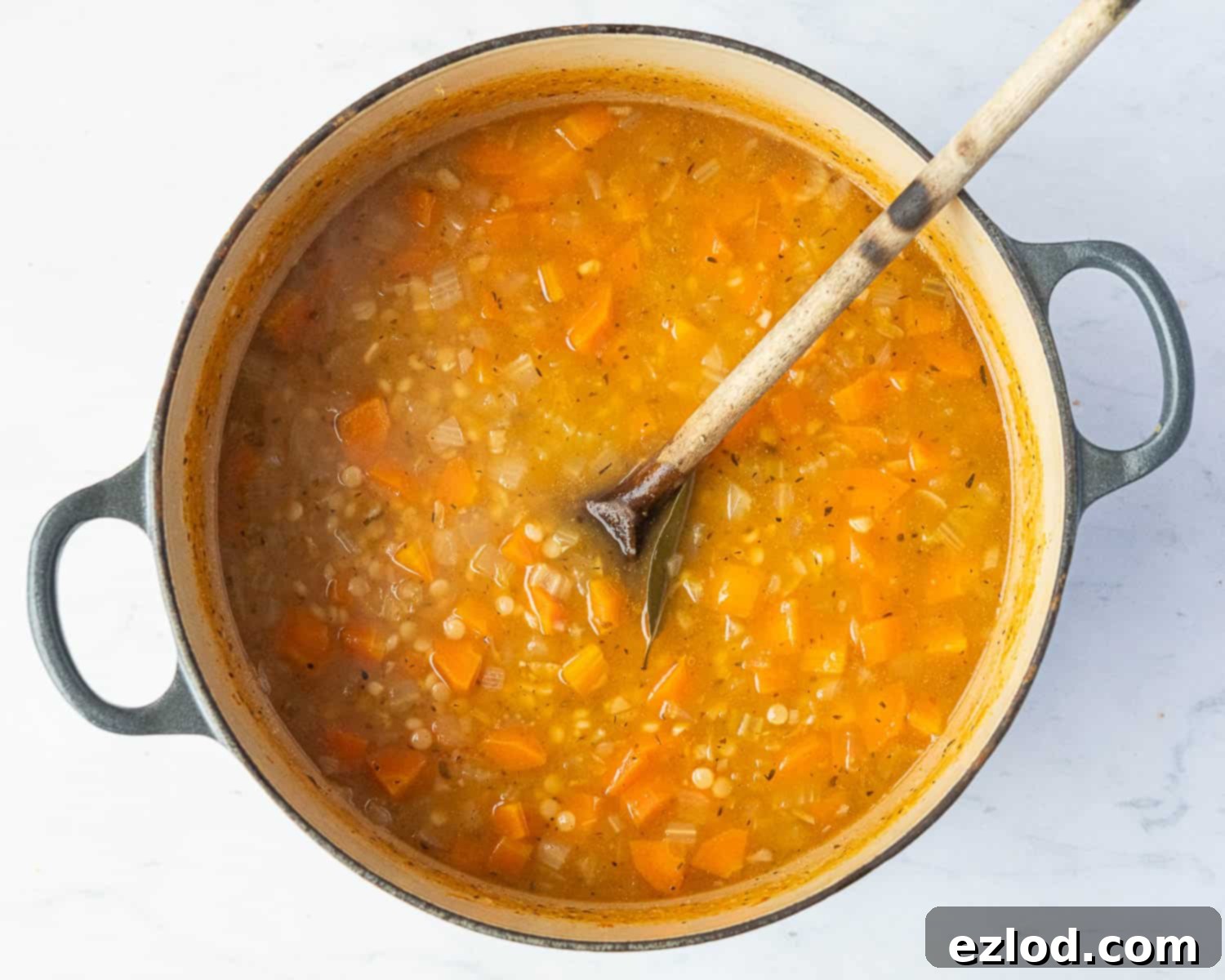 Velvety Vegan Pearl Couscous Soup 7 Step 3 in making creamy pearl couscous soup: the pearl couscous simmering with stock until tender and plump.