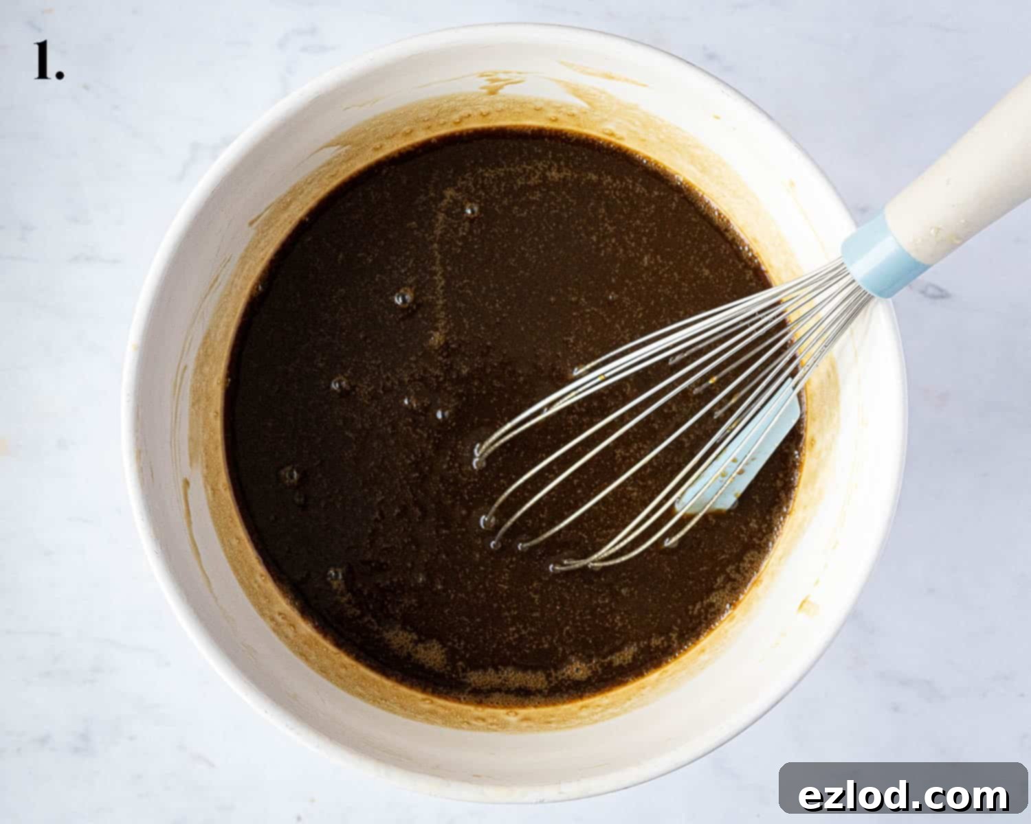 Decadent Vegan Chocolate Gingerbread Cake 5 Step 1: A mixing bowl containing the perfectly combined wet ingredients for the chocolate gingerbread batter.
