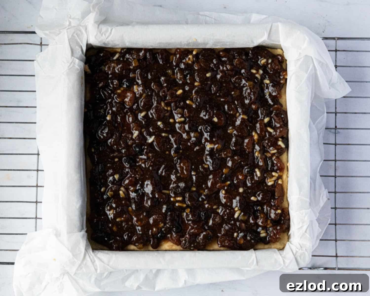 Festive Vegan Mince Pie Brownies 11 Step 7, the mincemeat spread on the shortbread base.