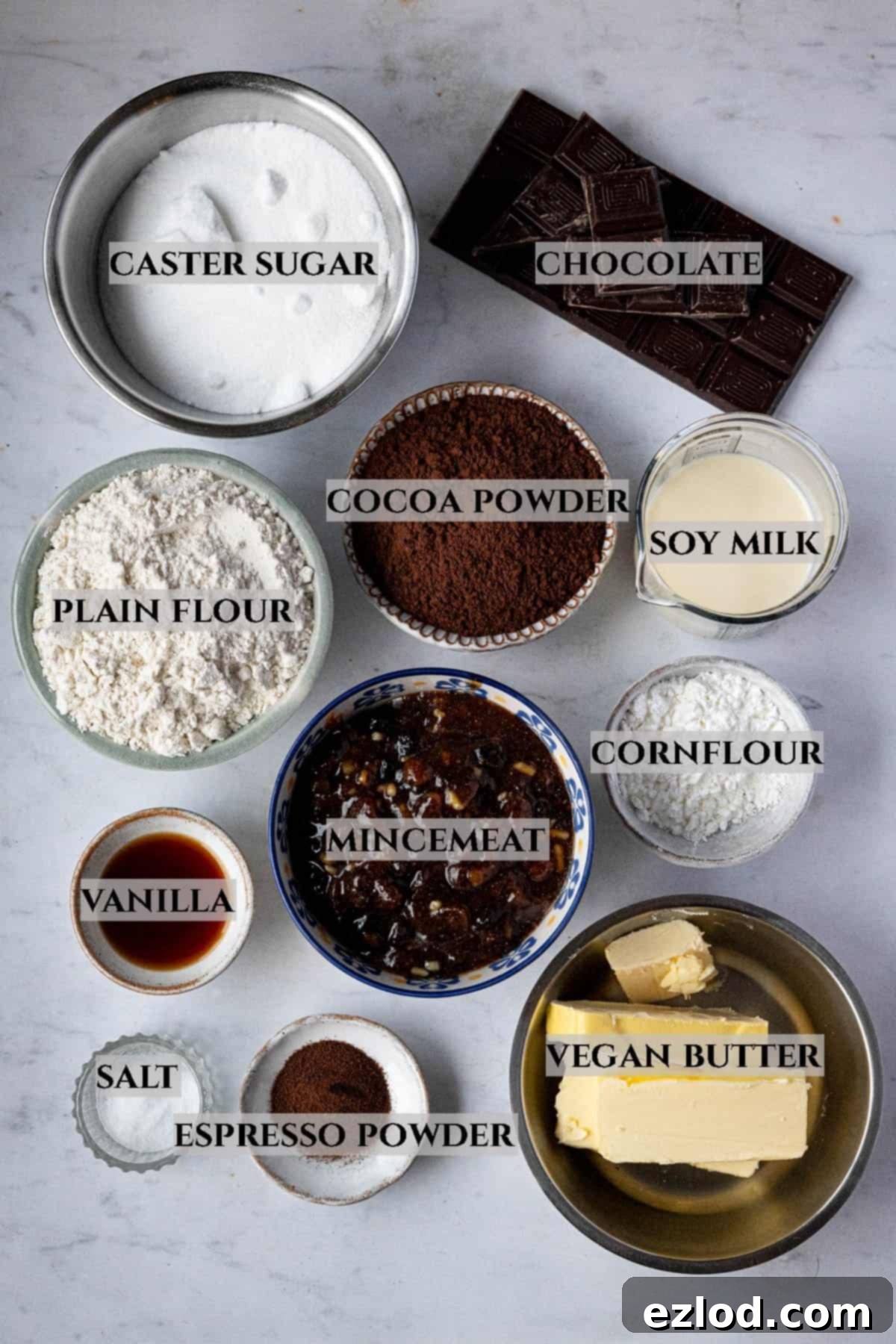 Festive Vegan Mince Pie Brownies 3 A labelled photo of the ingredients needed to make mince pie brownies in bowls.