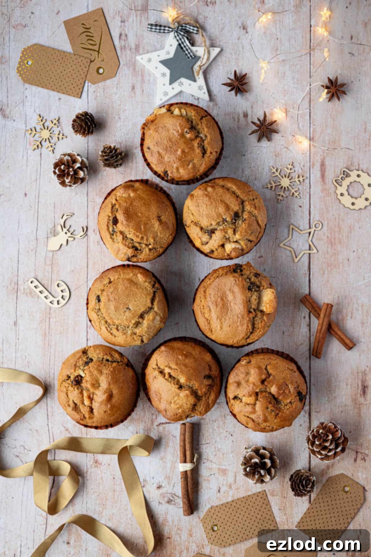 Festive Vegan Stollen Muffins 4 Vegan stollen muffins artfully arranged in the shape of a Christmas tree, ready to be enjoyed or shared.