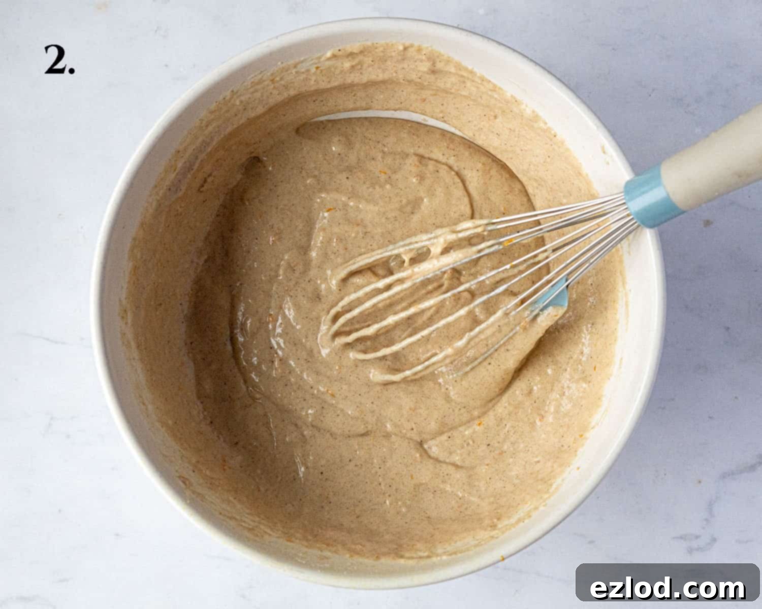Festive Vegan Stollen Muffins 6 Step 2: The wet ingredients are added to the dry mixture and gently stirred to form the muffin batter.