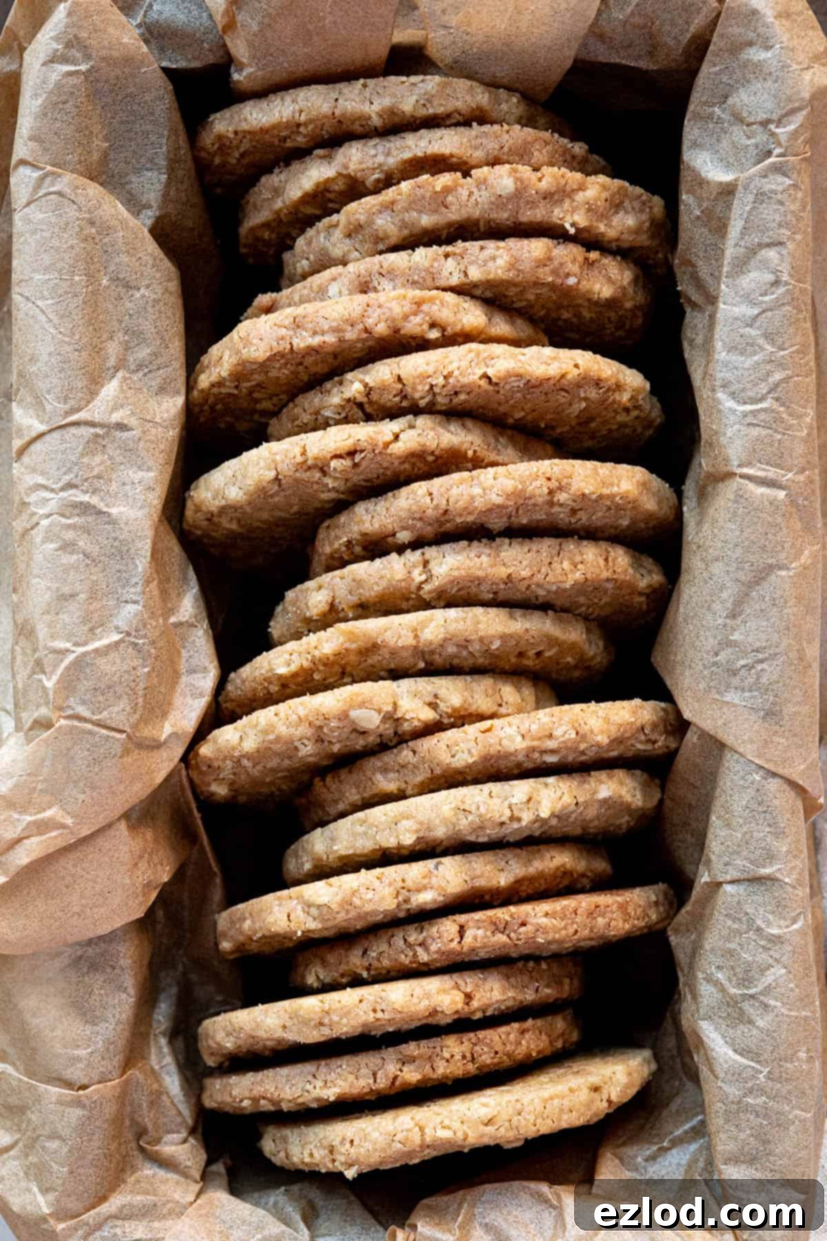 Close up of spiced oat biscuits in a loaf tin.