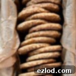 Close up of spiced oat biscuits in a loaf tin.