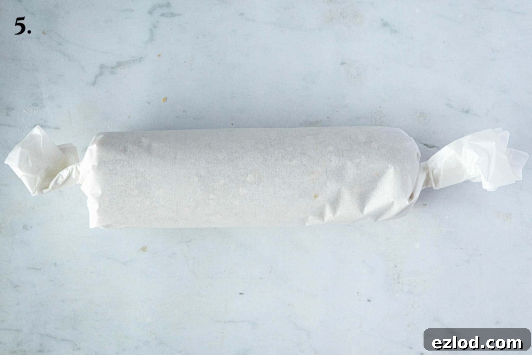 Step 5, the log wrapped in parchment.