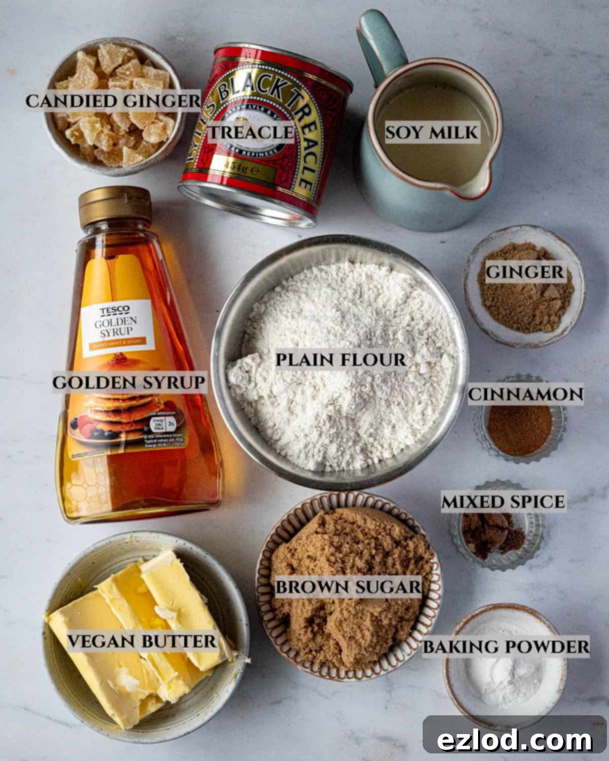 A labelled photo of the ingredients needed to make steamed gingerbread pudding, showcasing plant-based components.
