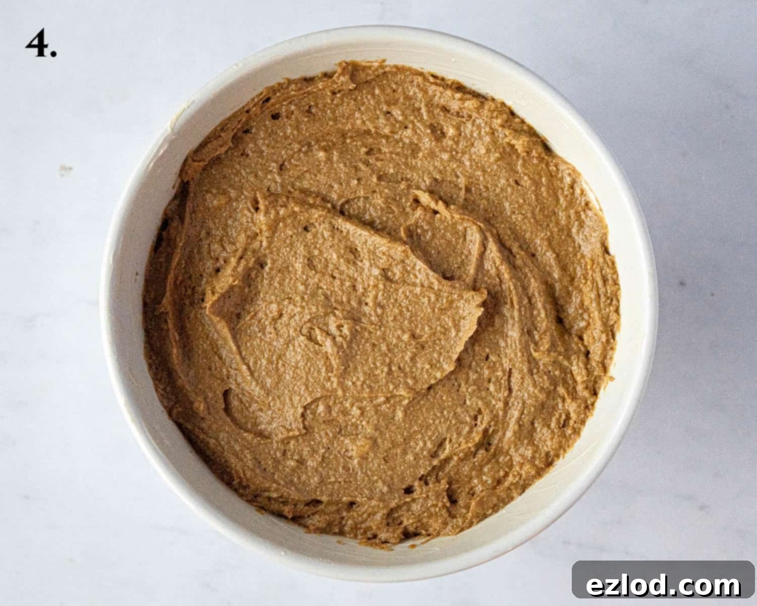 Step 4, showing the gingerbread batter poured into the pudding basin.