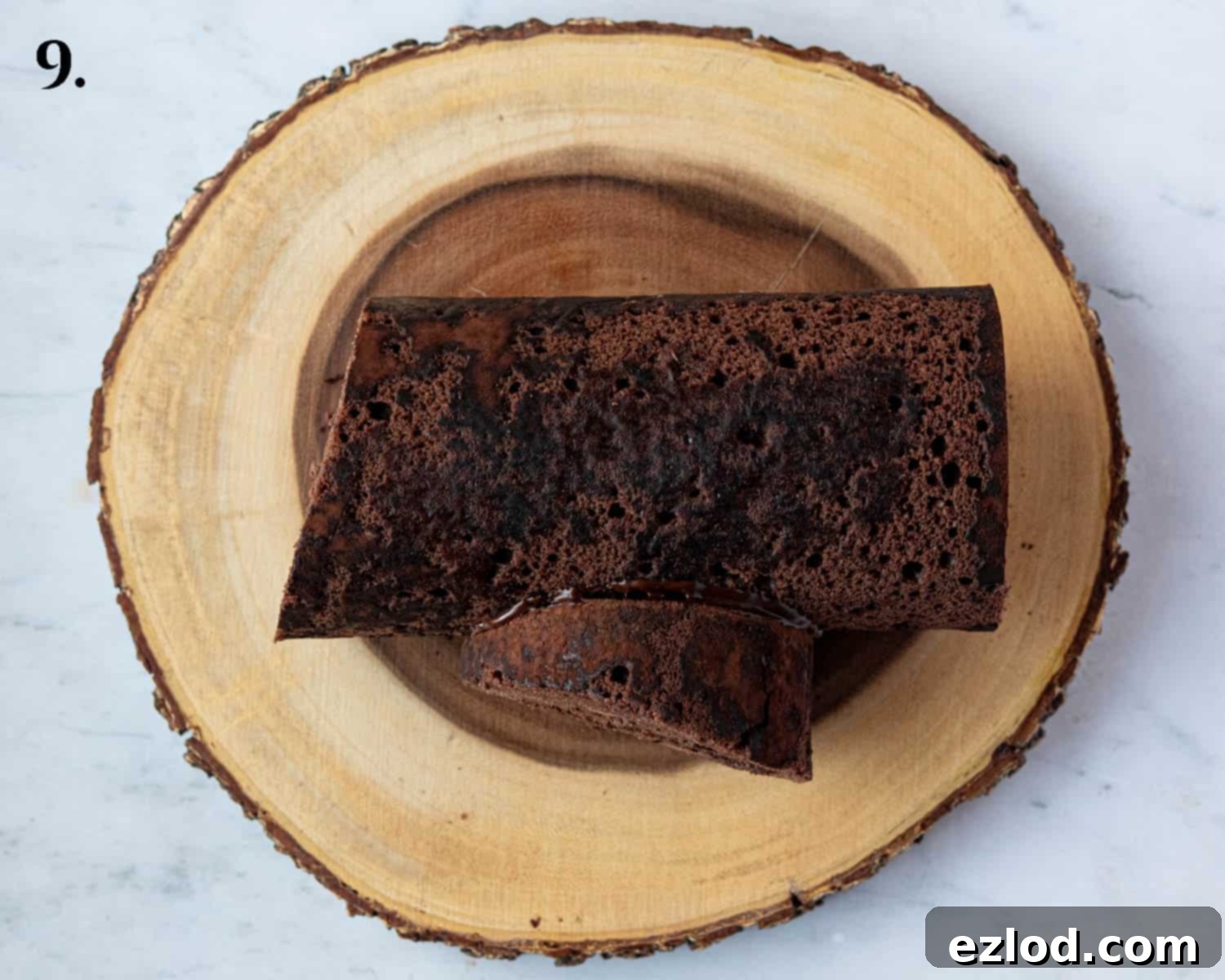 Plant-Based Chocolate Yule Log 13 Step 8: The yule log, with one end sliced off at an angle and reattached to the side to form a branch, now ready for ganache.