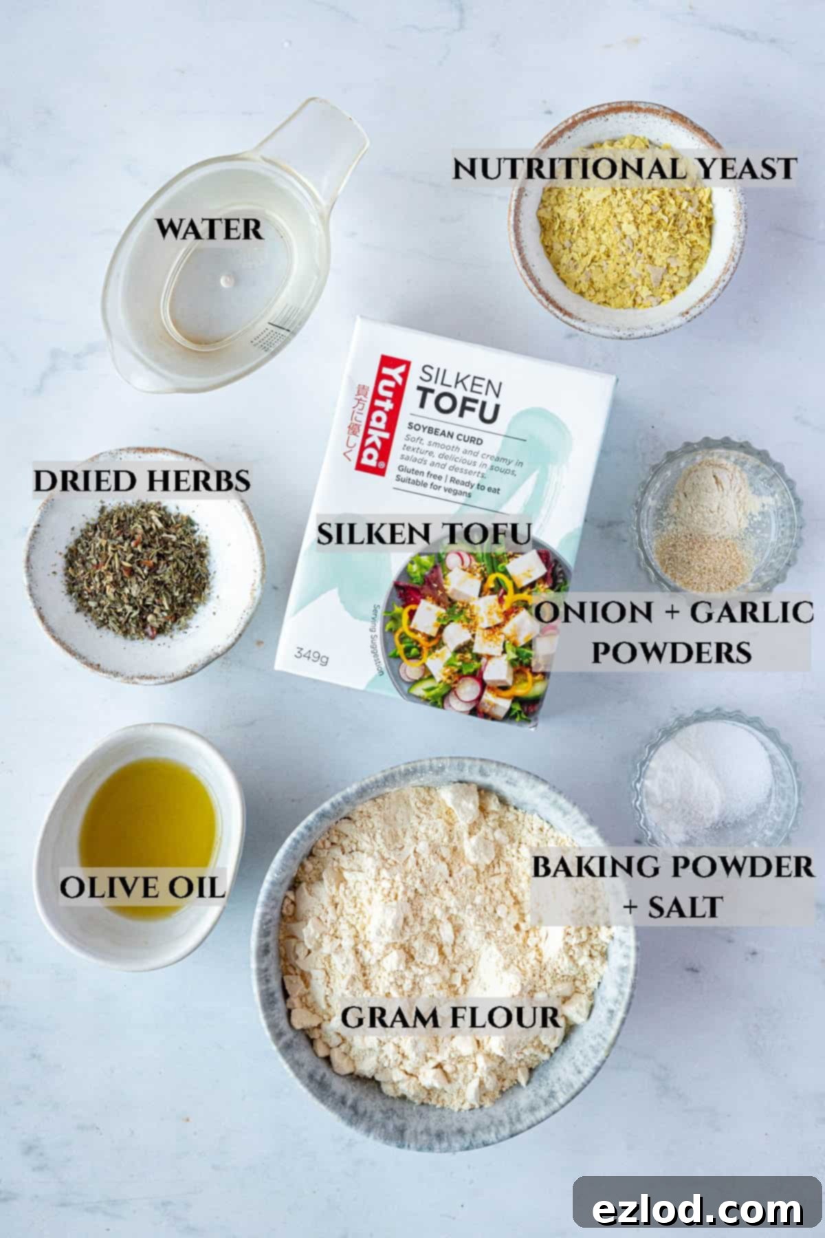 Golden Chickpea Fritters 3 A labelled overhead photo displaying all the fresh and dry ingredients required to prepare the savoury chickpea pancake recipe.