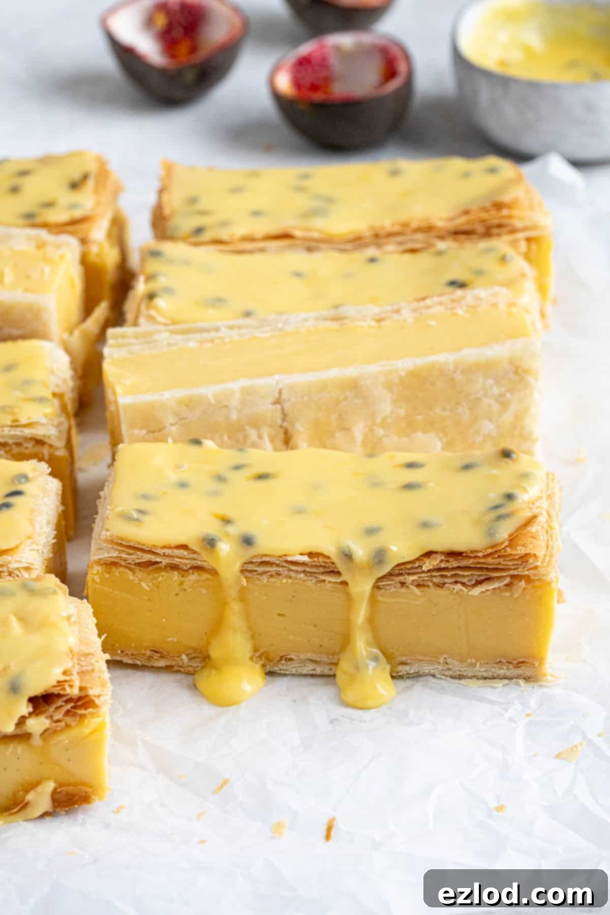 Close up of the vegan vanilla slices topped with passion fruit glaze.