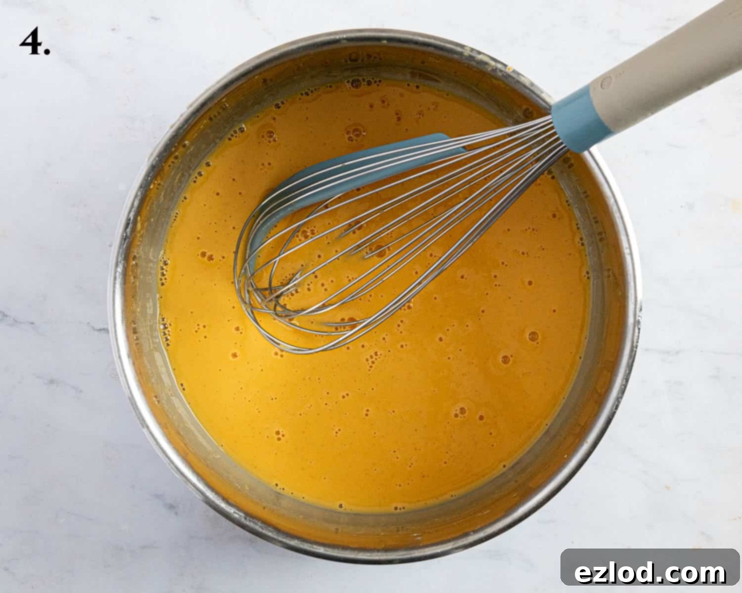 Step 4: Cornflour gradually mixed into passion fruit juice in a saucepan, beginning the tart filling.