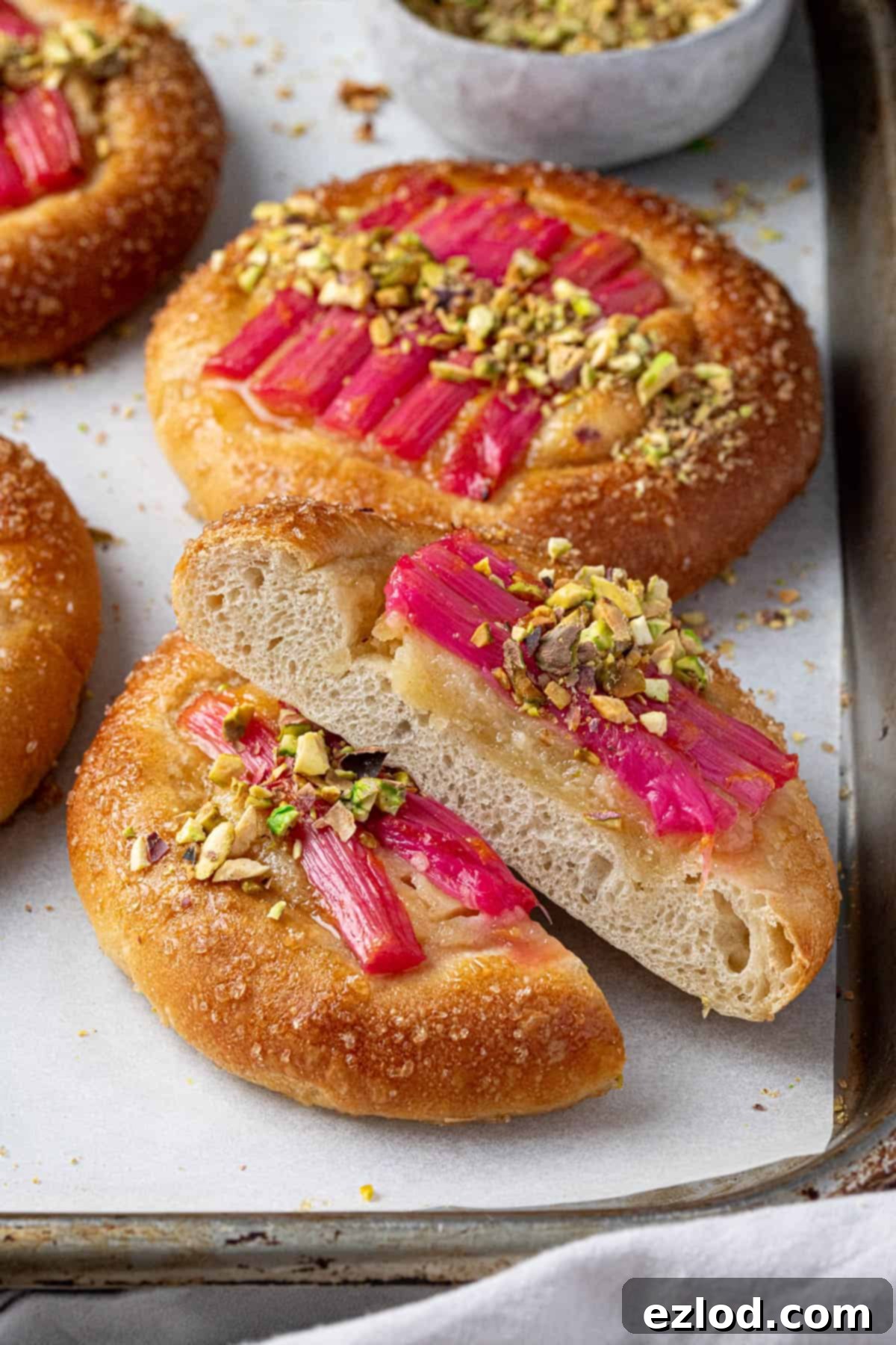 Close up of a sliced rhubarb frangipane bun.