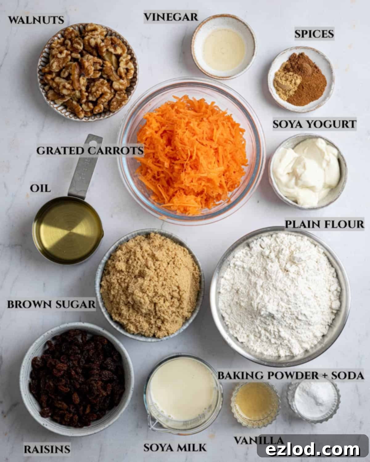 Perfectly Moist Vegan Carrot Muffins 3 A labelled photo of the ingredients needed to make vegan carrot muffins.