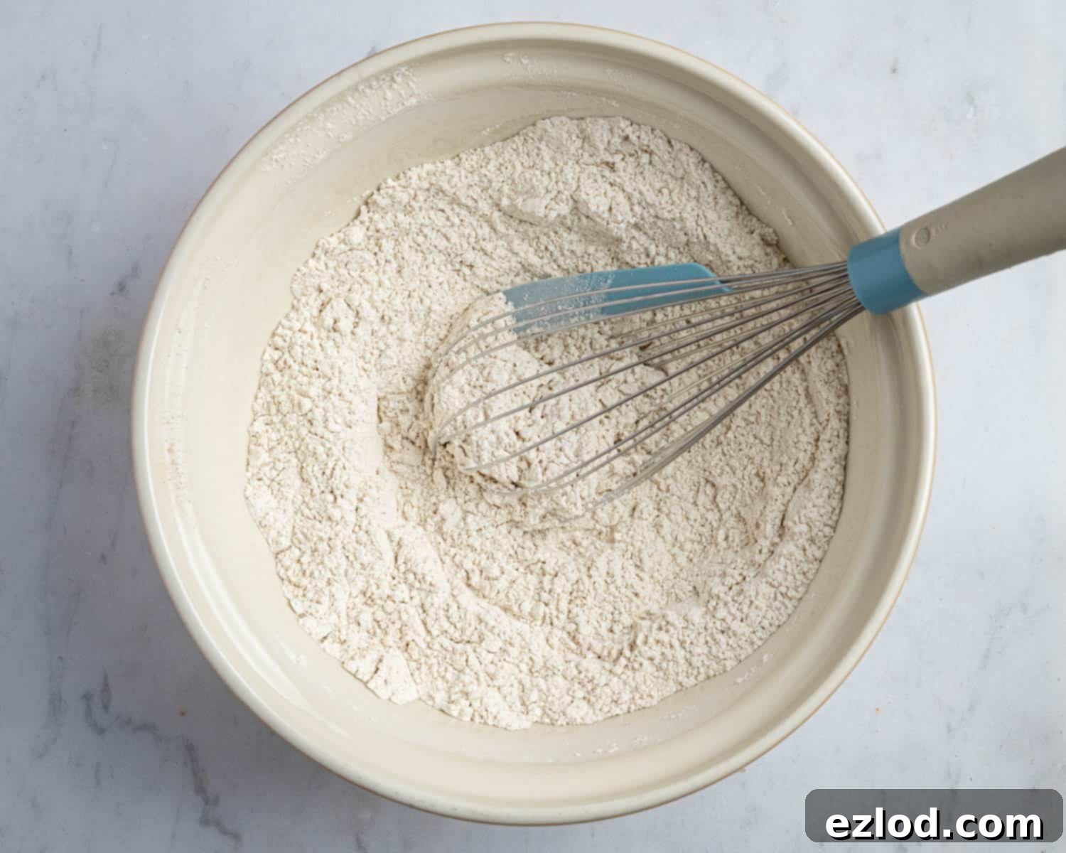 Perfectly Moist Vegan Carrot Muffins 5 Step 1, the dry ingredients in a bowl.