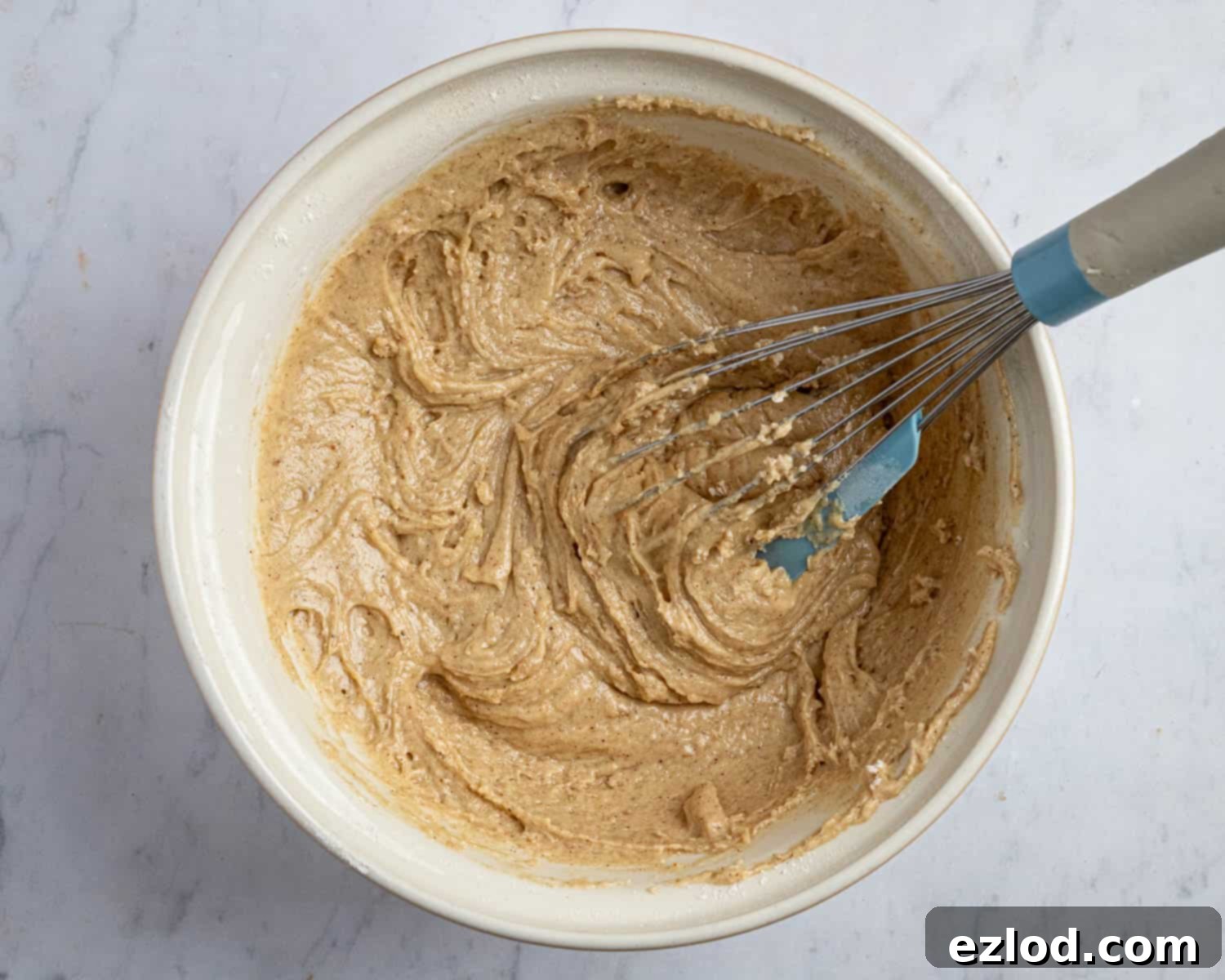 Perfectly Moist Vegan Carrot Muffins 7 Step 3, the batter in a bowl.