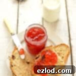 Plum and amaretto jam in jars with fresh plums