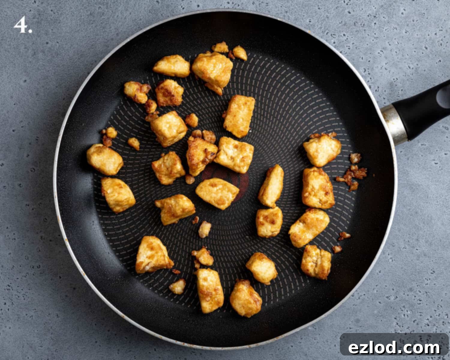 Step 4, the fried tofu in a pan.