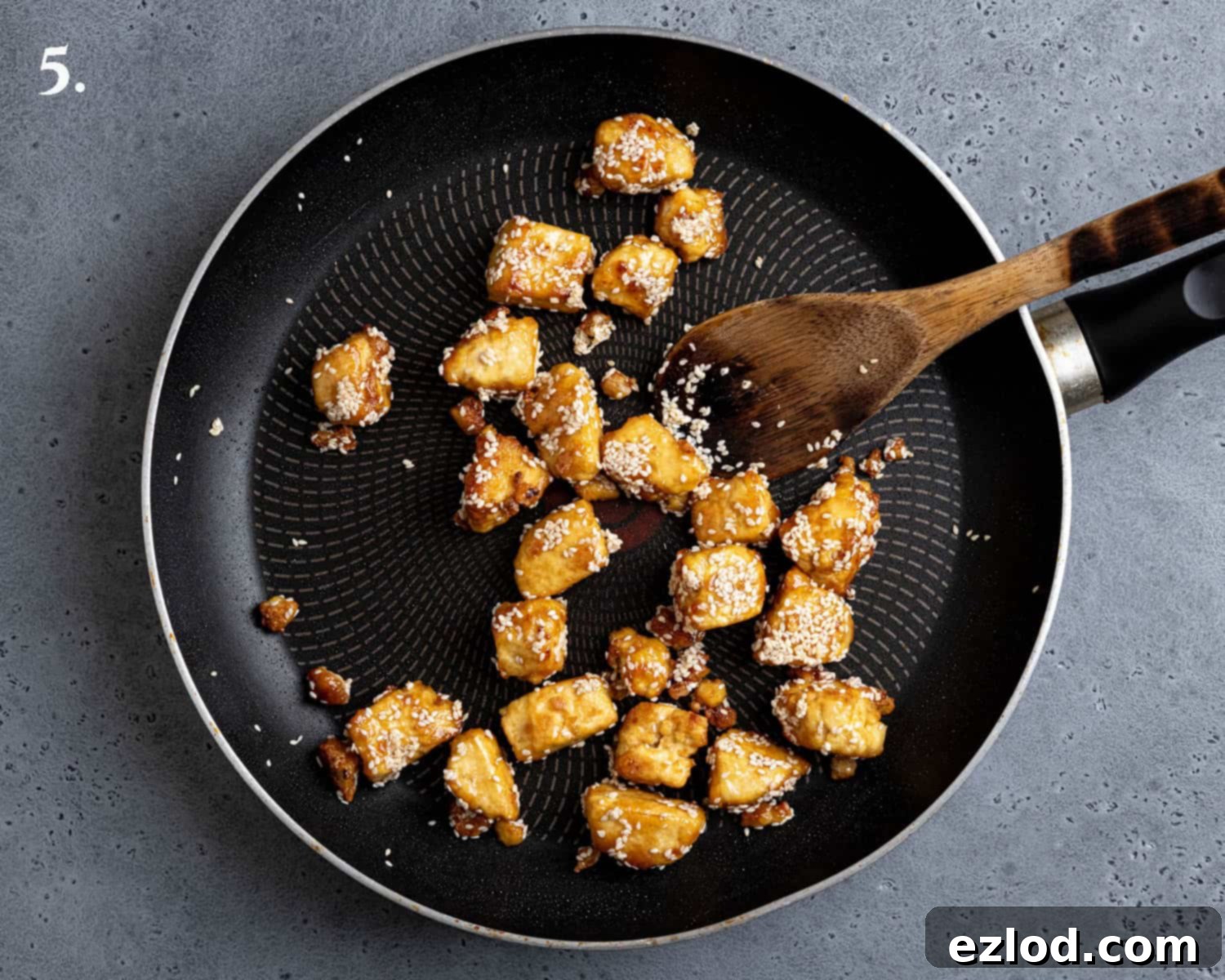 Step 5, the tofu with the sesame seeds and maple syrup added.