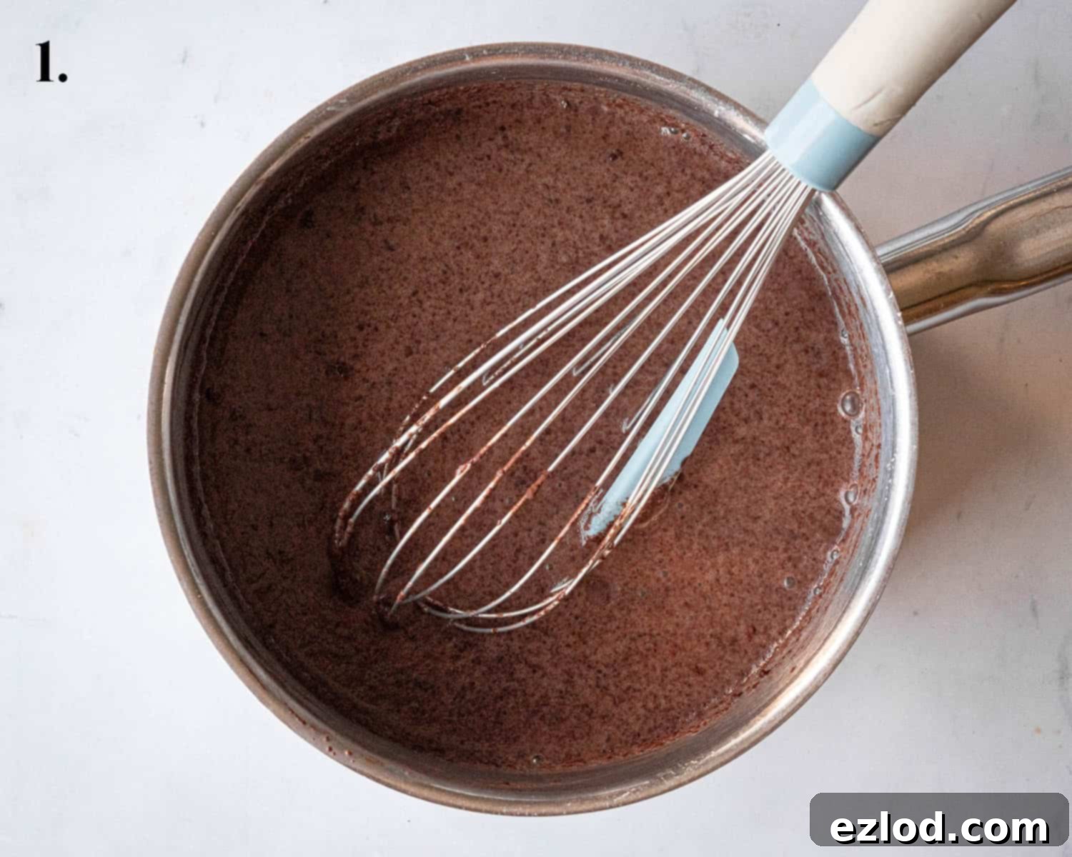 Step 1, the ingredients whisked together in a pan.