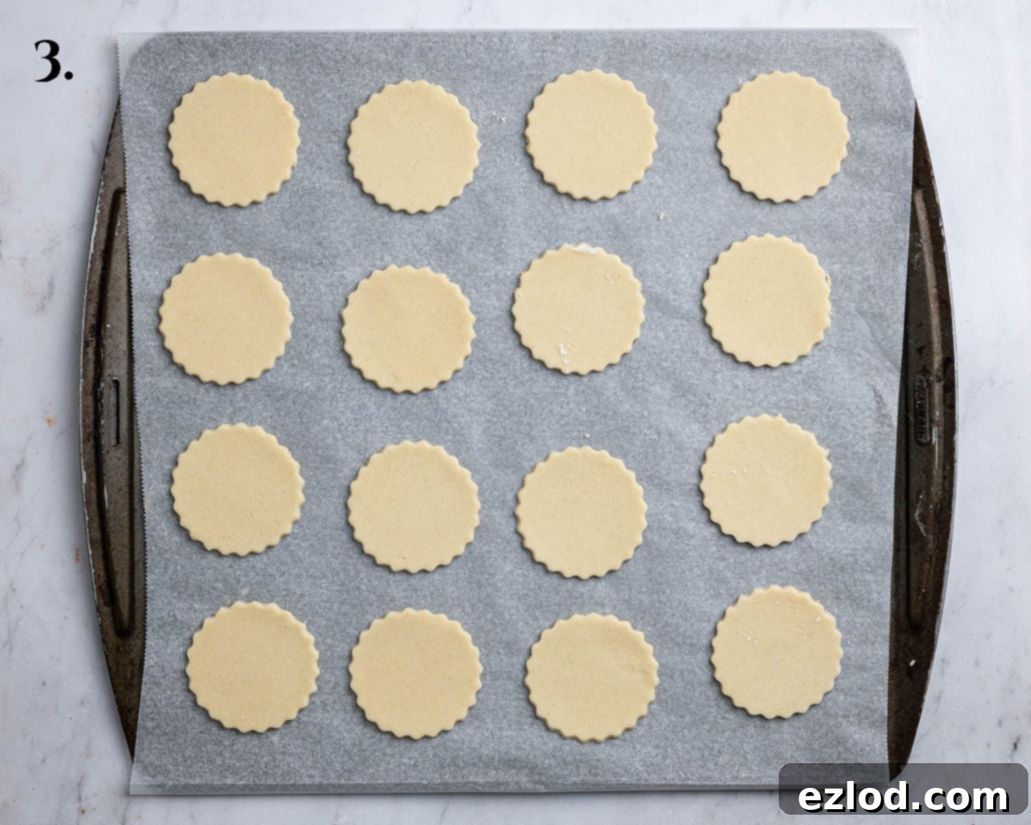 Step 3, the cookie cut outs on a baking sheet.