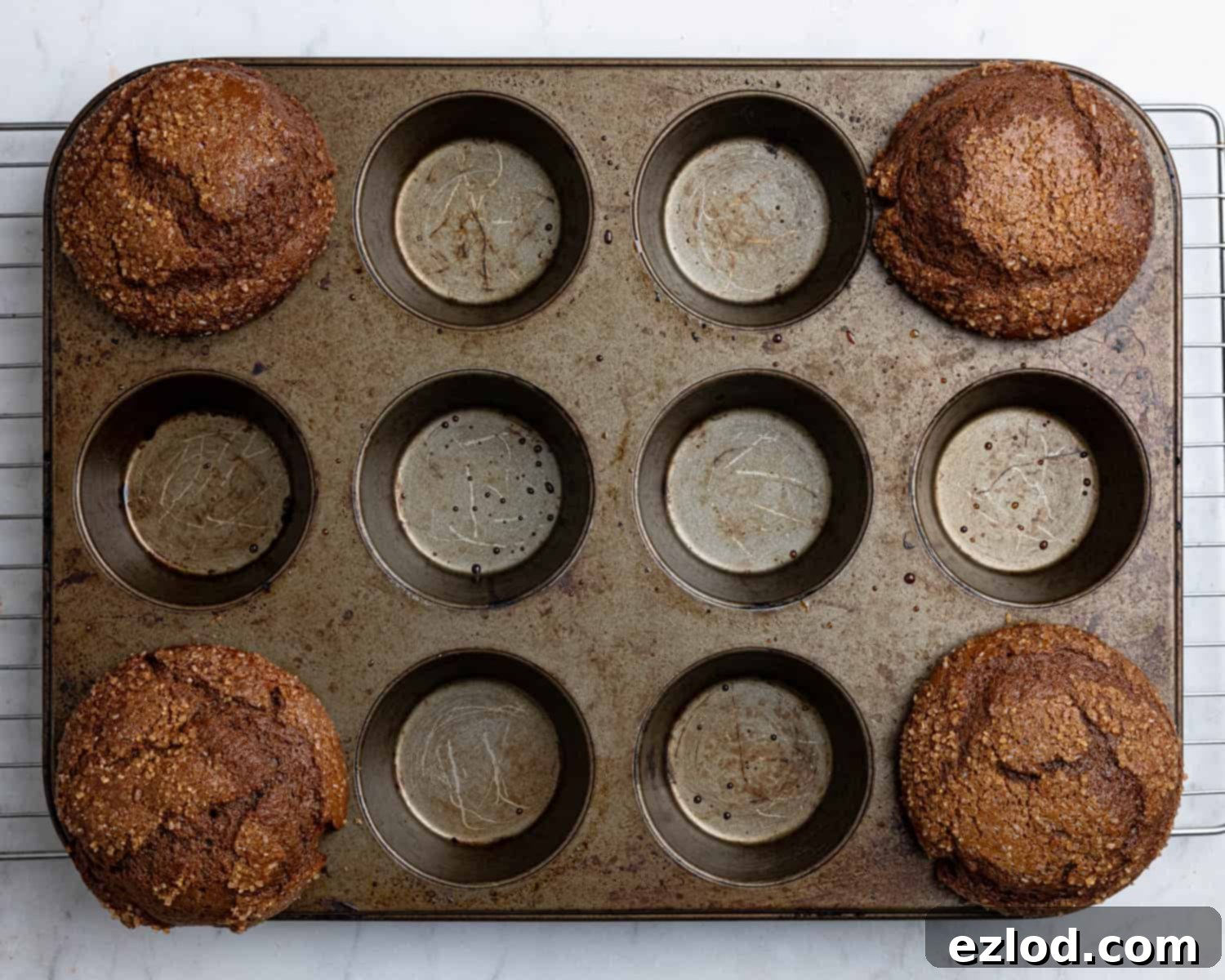 Step 4: Freshly baked vegan gingerbread muffins in the muffin tin, golden brown and perfectly risen.