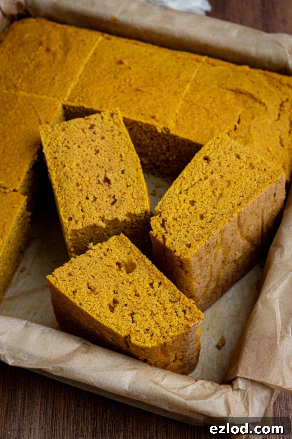 Golden Harvest Vegan Cornbread 4 Squares of vegan pumpkin cornbread in a tin.