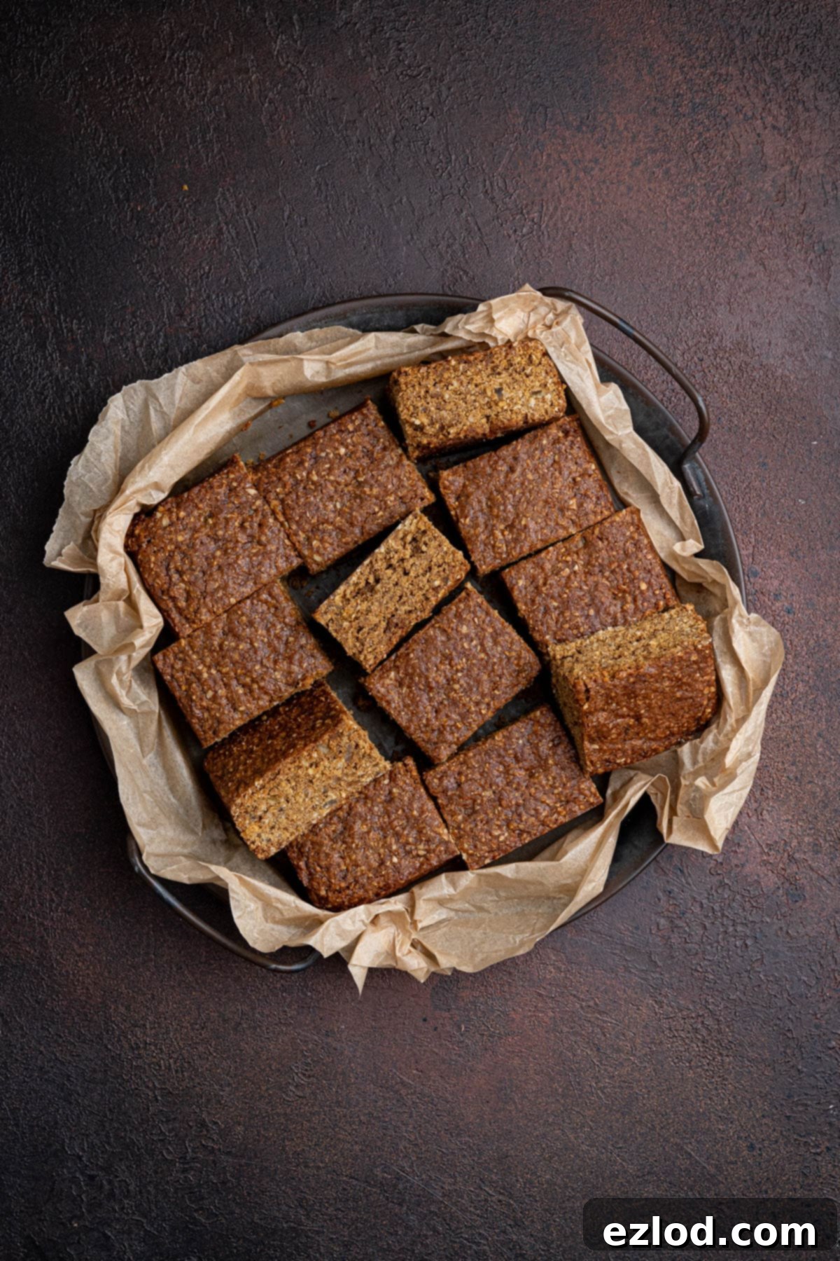 Sliced vegan Thor cake on a parchment lined tray.