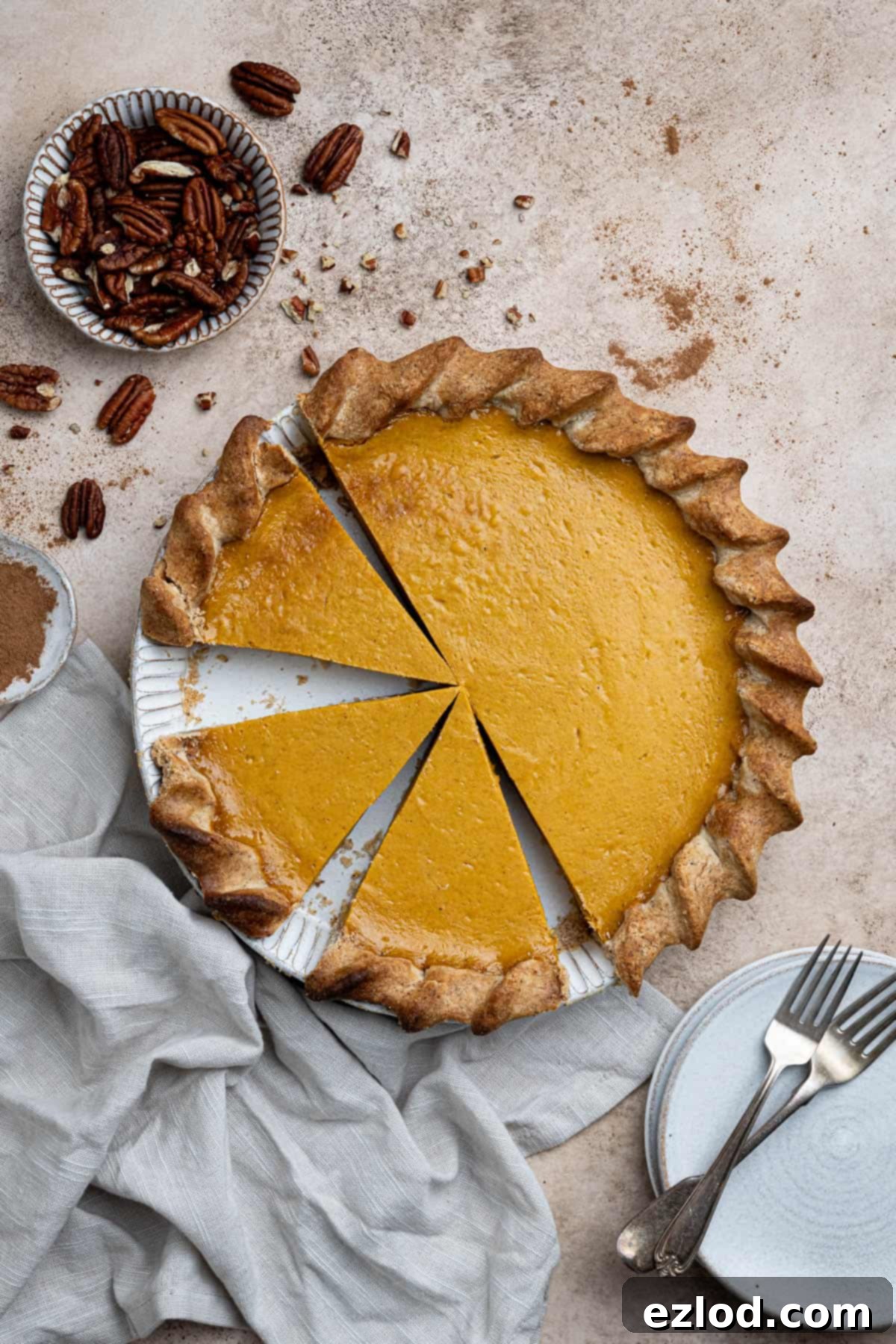 The sliced vegan sweet potato pie in a white pie dish.