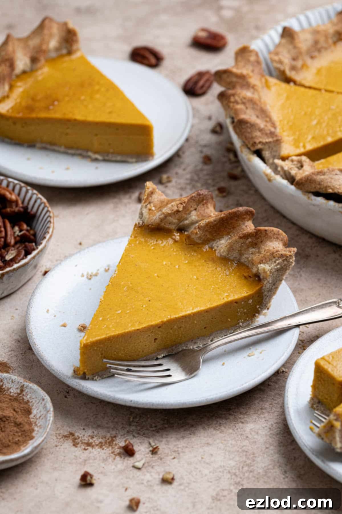 Close up of a slice of vegan sweet potato pie on a white plate.