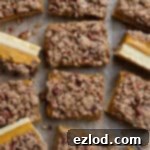 Vegan pumpkin crumb bars on a sheet of baking paper.