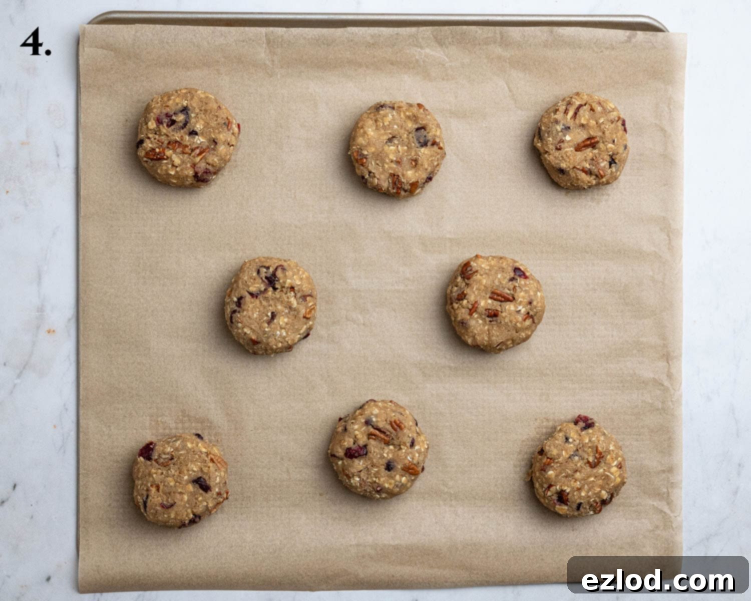 Step 4: Chilled cookie dough rolled into uniform balls, slightly flattened, and spaced on a baking sheet.