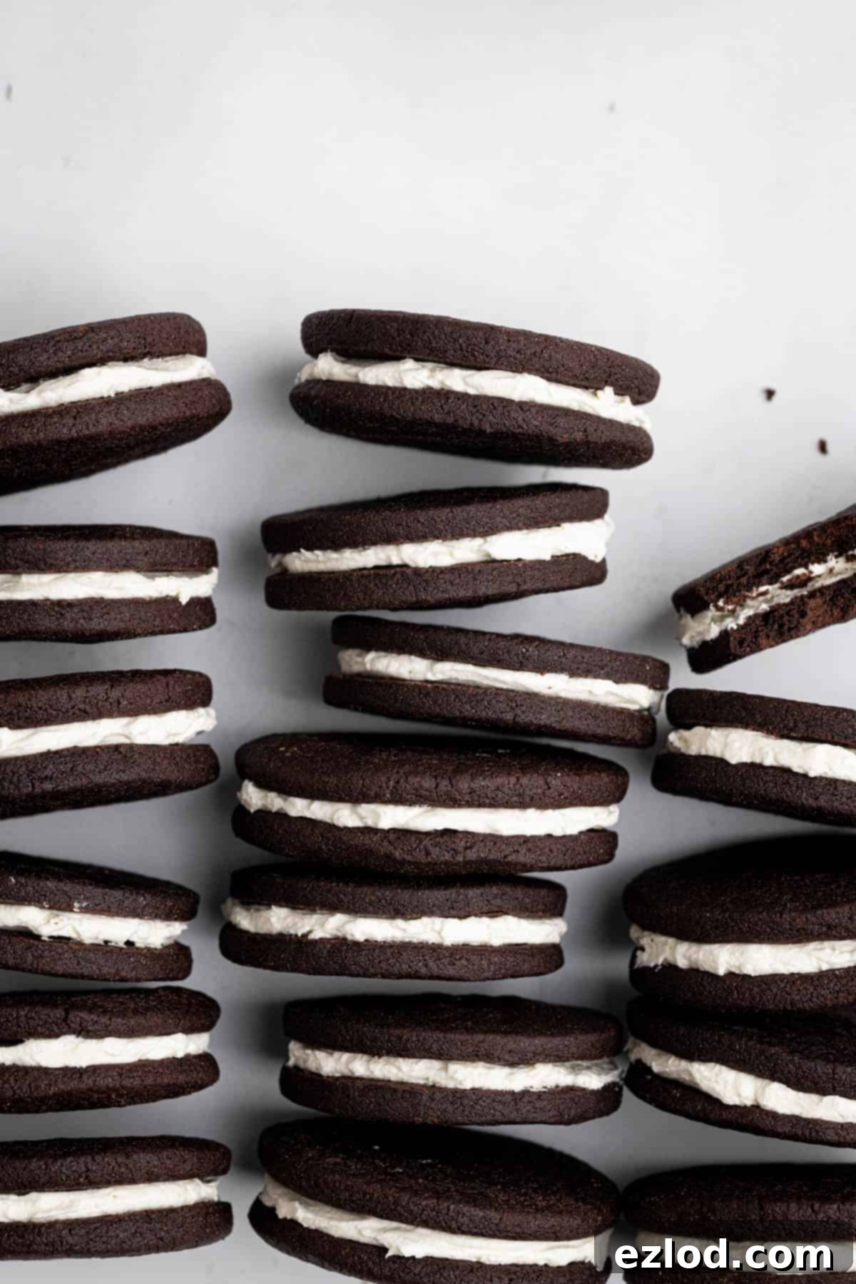 Beautiful rows of vegan mint chocolate sandwich cookies displayed neatly on their sides, ready to be enjoyed.