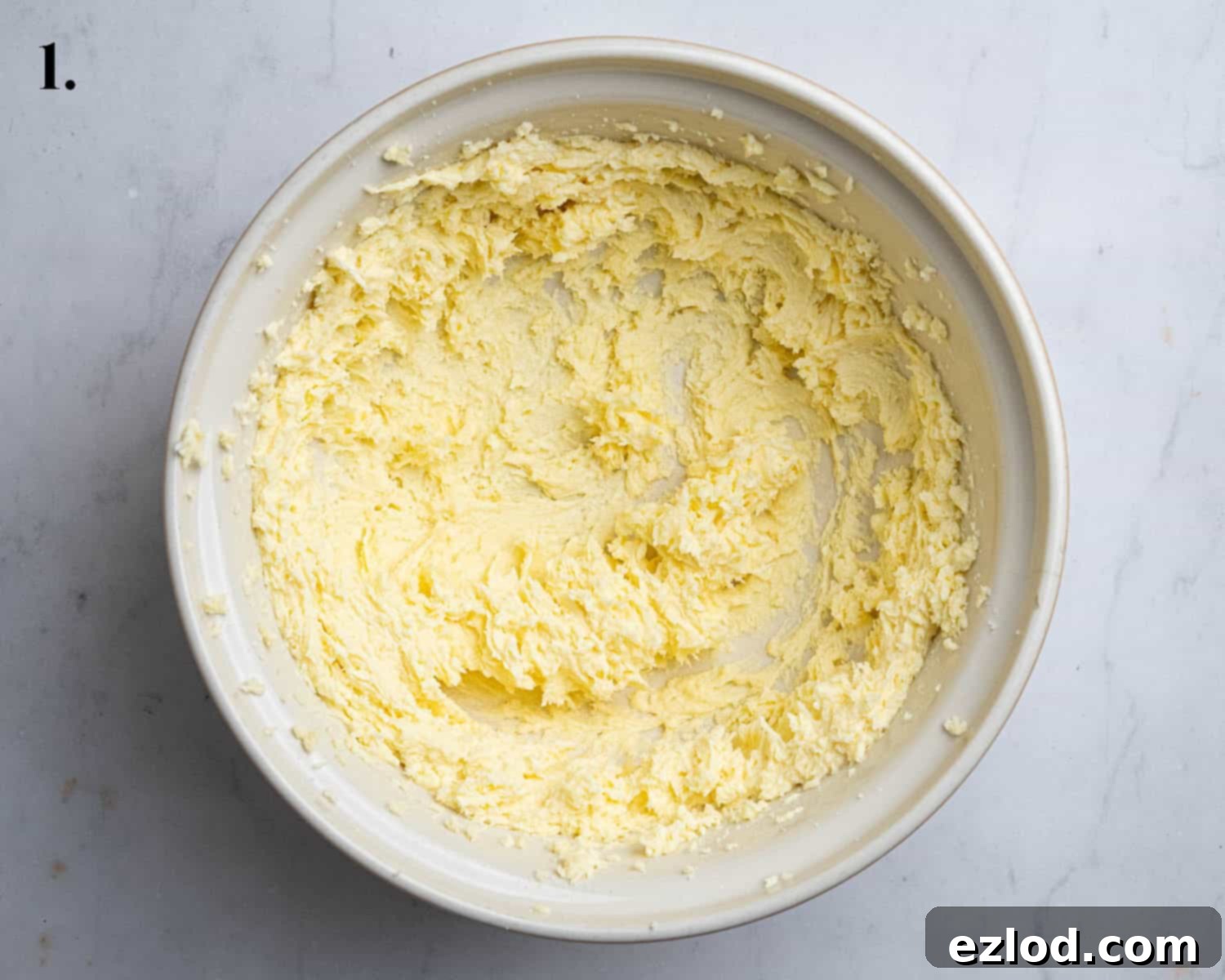Step 1 in making vegan mint chocolate sandwich cookies: The perfectly whisked vegan butter and sugar mixture in a bowl.