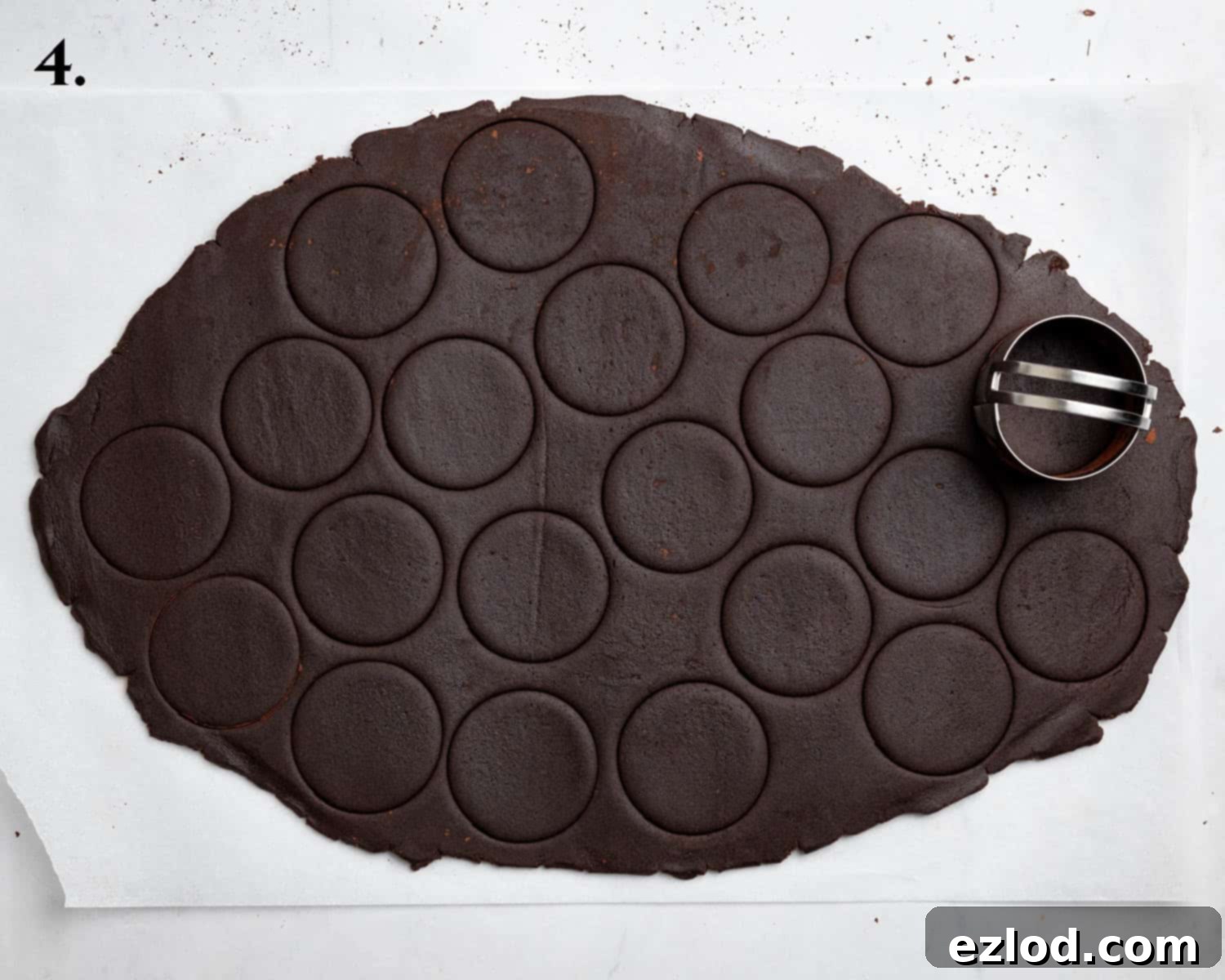 Step 4 in making vegan mint chocolate sandwich cookies: The chocolate dough rolled out with perfectly cut rounds, ready for baking.
