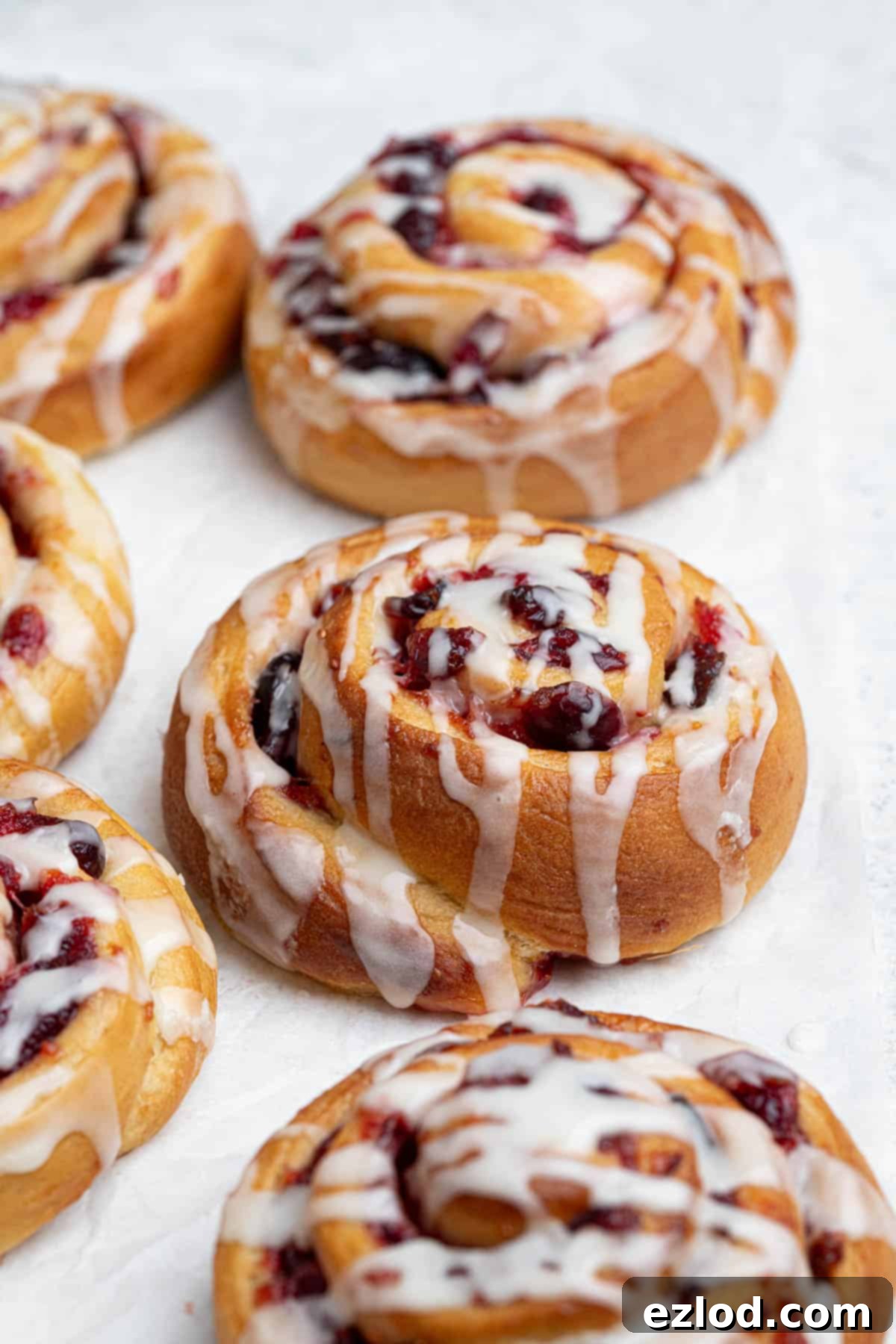 Close up of a vegan cranberry orange roll.