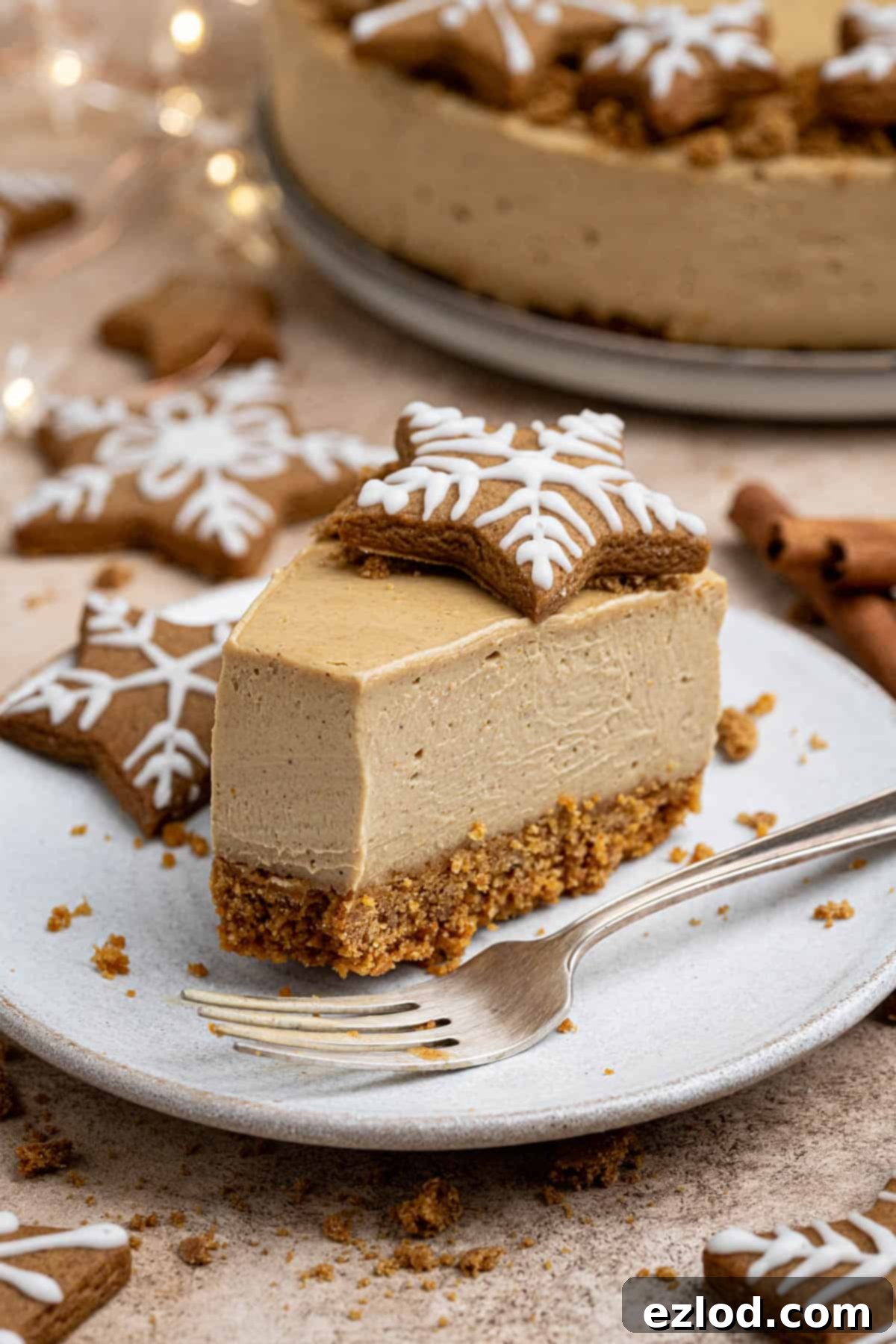 A slice of vegan gingerbread cheesecake with a forkful removed.