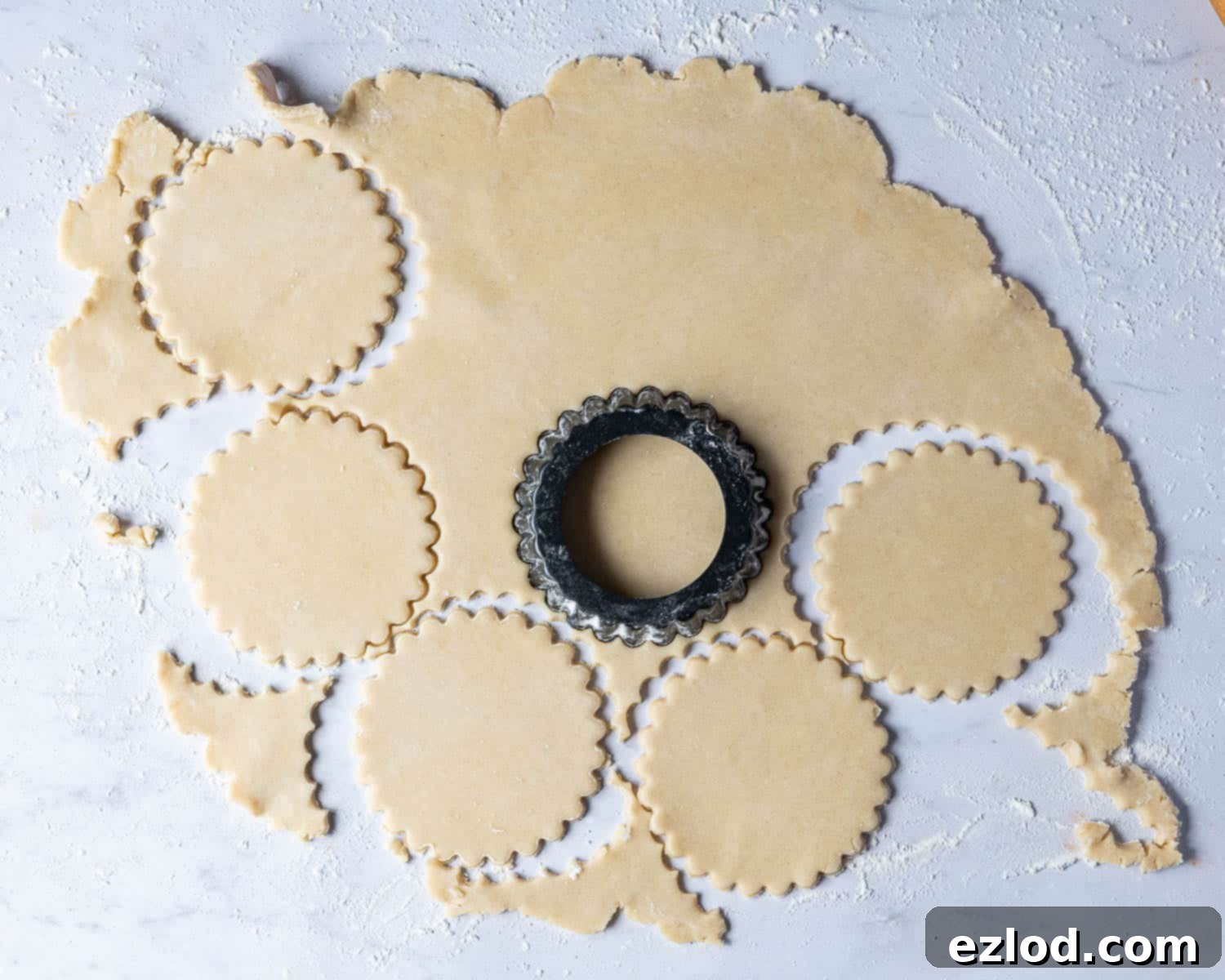 Step 2, the rolled out pastry with rounds being stamped out.